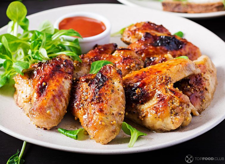 2021-09-09-gxapw4-grilled-chicken-wings-baked-chicken-wings-on-woode-6guddlm