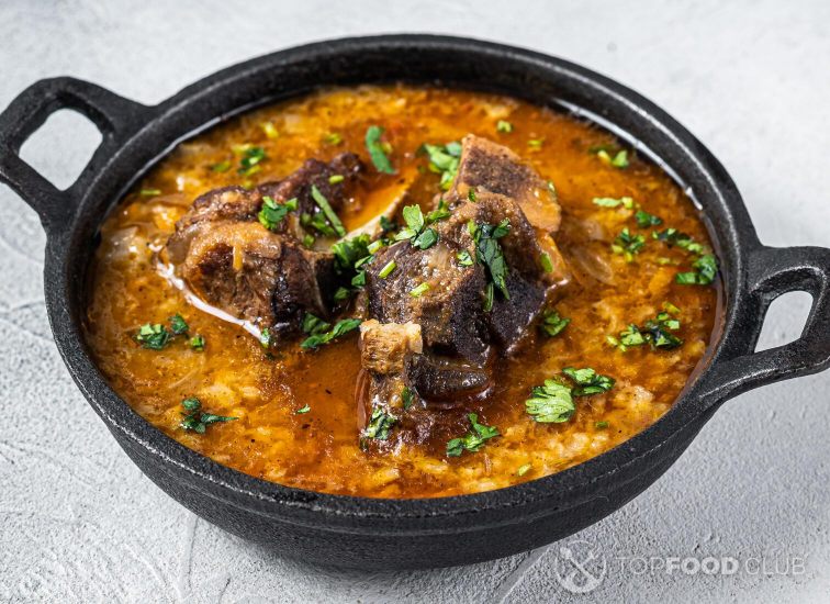 2021-09-23-nrxomv-kharcho-soup-with-beef-meat-rice-tomatoes-and-spices-in-a-pan