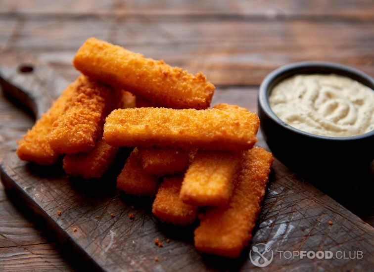 2021-09-29-4vgdwi-pile-of-golden-fried-fish-fingers-with-white-garli-jgzspl3