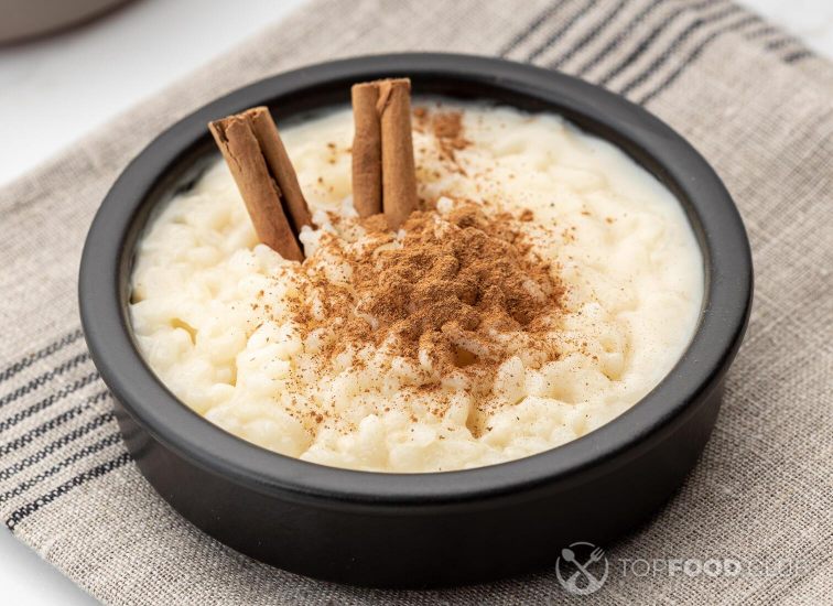 2021-10-07-o8ey6m-creamy-rice-pudding-with-cinnamon-in-bowl-on-white-hu2wawc
