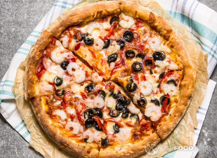 2021-11-29-rx4q7b-fresh-seafood-pizza-with-shrimp-on-stone-table-2021-09-03-09-07-05-utc