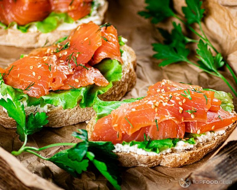 2022-11-19-exvo6m-salmon-sandwich-on-paper-macro-background