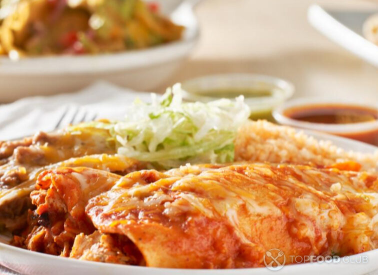 2022-12-09-gc9k04-mexican-enchilada-platter-with-red-sauce-refried-2022-03-22-16-10-08-utc-1