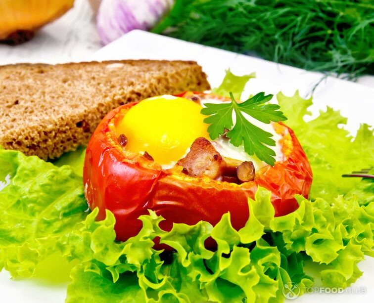 2022-12-13-ayth8n-scrambled-eggs-in-tomato-and-bread-on-light-board-2021-08-26-16-02-45-utc-1