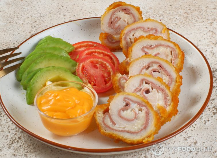 2023-08-21-w4laos-sliced-chicken-cordon-bleu-and-a-salad-on-a-plate-2023-05-30-08-26-04-utc123