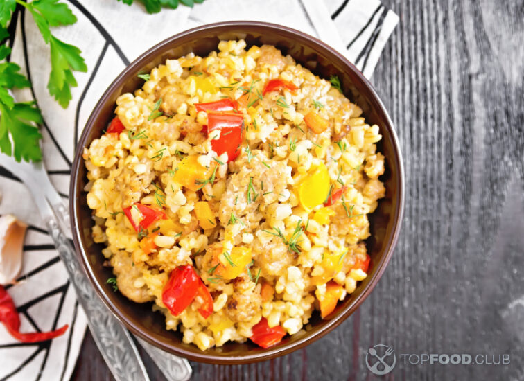 2023-11-20-zn8pkl-barley-porridge-with-minced-meat-in-bowl-on-black-2021-12-14-02-30-34-utc