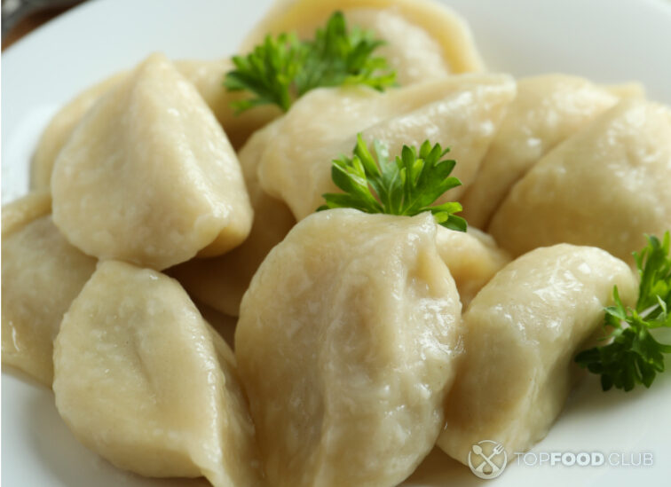 2024-03-05-oc6nkp-concept-of-tasty-food-with-vareniki-or-pierogi-cl-2023-11-27-05-28-19-utc