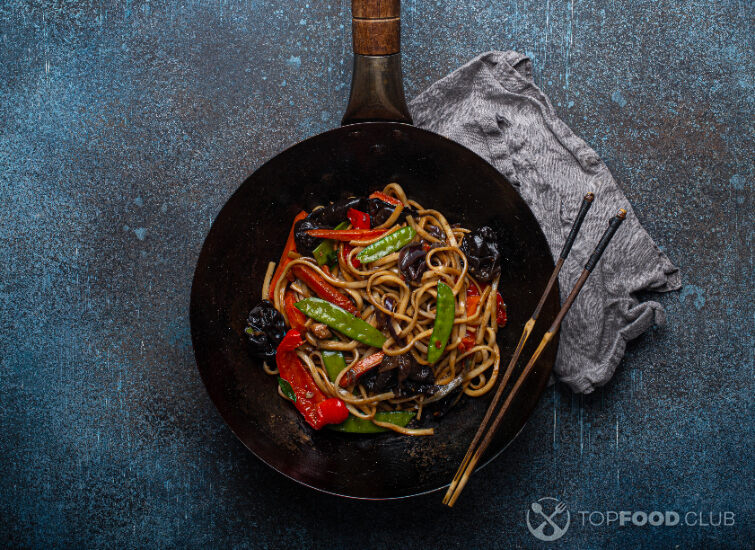 2024-03-29-qwabd0-asian-stir-fry-noodles-with-vegetables-in-black-wo-2023-11-27-05-19-56-utc