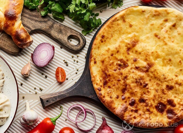 2021-10-13-0b6knr-top-view-of-delicious-khinkali-and-khachapuri-near-a5txgap