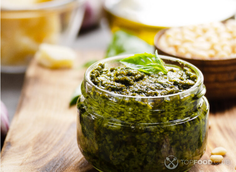 2024-08-22-t60rdl-glass-jar-with-pesto-sauce-on-cutting-board-2023-11-27-05-35-52-utc