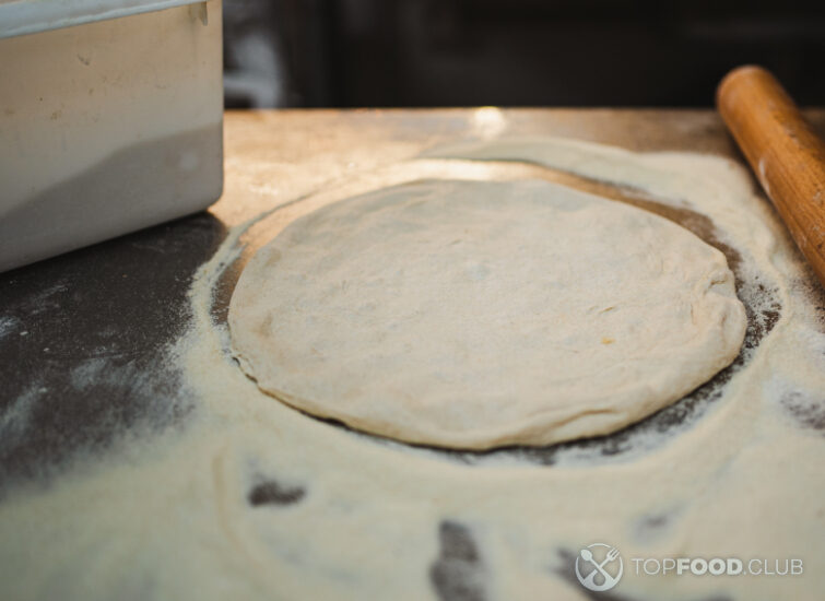 2025-05-29-nfgqjw-uncooked-pizza-dough-in-artisan-bakery-2025-01-09-04-25-26-utc