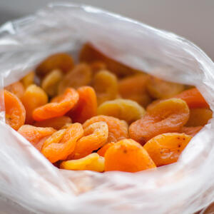 Pour hot water over dried fruits. Stand for 10 minutes.