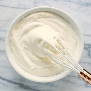Whip cream with a whisk.