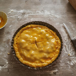 Moisten the edge of the dough with water.