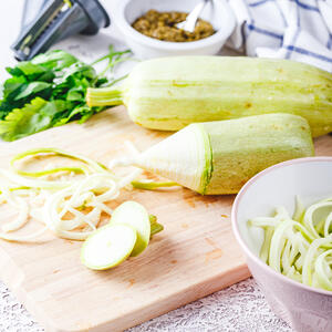 Grate zucchini.