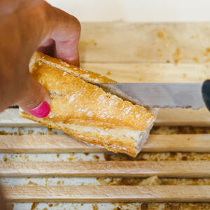 Cut baguette in half