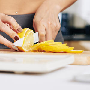 Rinse lemon, cut into rings