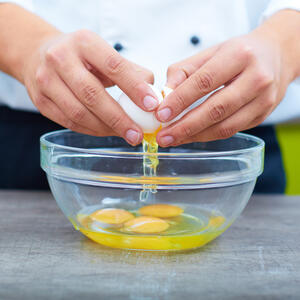 Break the eggs for making sauce