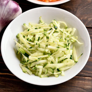 Rinse squash, then grate.