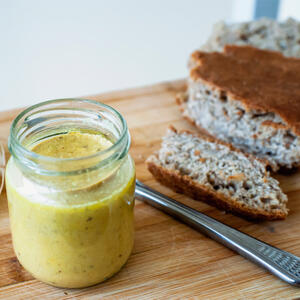 Slather the bread with hummus.