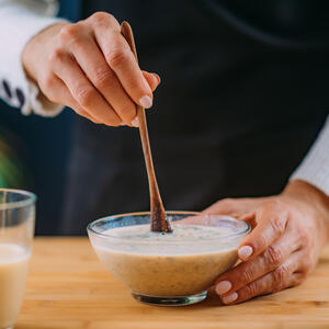 To mix oats with milk.