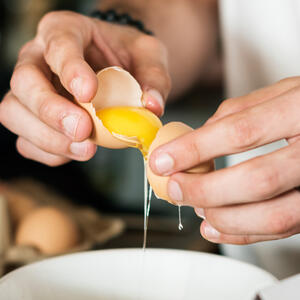 Crack the eggs and separate the white from the yolk.