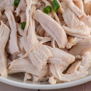 Remove chicken meat from the broth and finely cut it