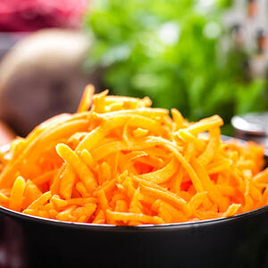 Grate carrots