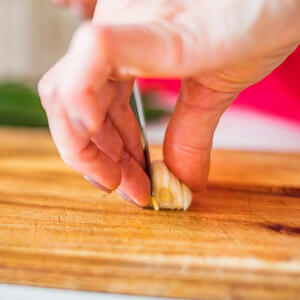 Cut garlic with a knife