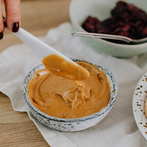 Toast the bread and spread with peanut butter.