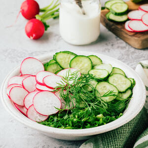 Add chives, parsley, cucumbers, pickles, eggs and radishes, in a large bowl.