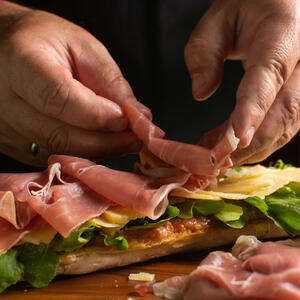  Top half of the slices with cheese, corned beef, and sauerkraut. 