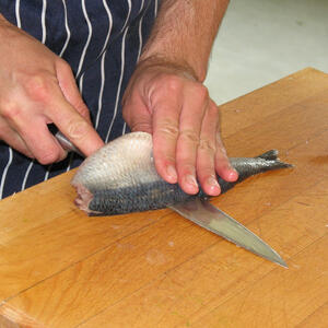 Cut the herring into fillets, then into small pieces.
