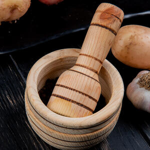 Take a few anchovies and mash in a mortar together with garlic