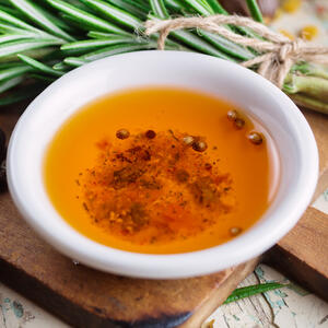 Mix the remaining olive oil .