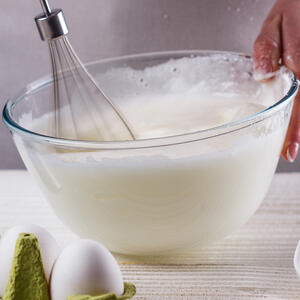 Put the icing sugar in a bowl, and mix in enough milk.