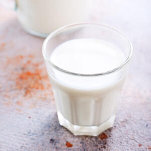 Then pour the milk. Mix everything with a help of whisk or fork.