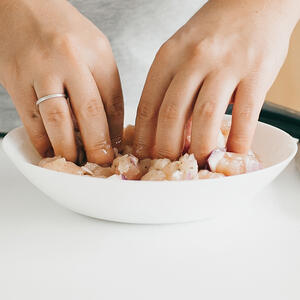 Dip the marinated chicken with starch.