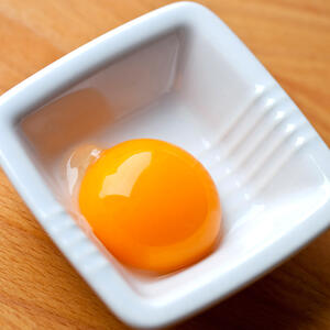 Break the egg and beat it