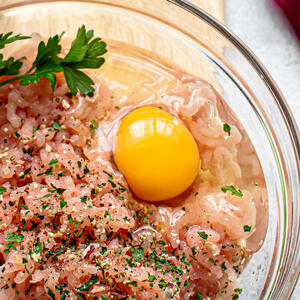 Break the egg into a bowl and add to the ground turkey