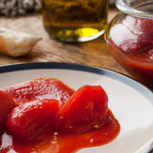 Put the canned tomatoes into a blender jar