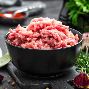 Combine ground pork, chopped cabbage and onion, spices