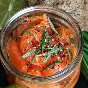 Open a can of salmon, drain the liquids and mash the required amount of fish with a fork.