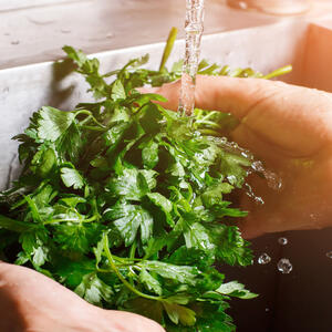 Wash the herbs, finely cut it and add to the frying pan