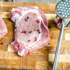 Tenderize meat with mallet, then cut it into cubes.