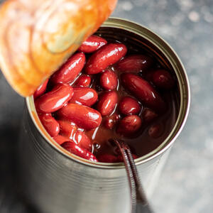 Open the can with beans, drain the water and add to the frying pan