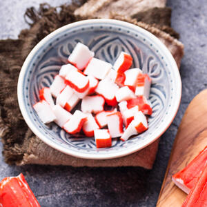 Defrost imitation crab meat, cut into cubes.