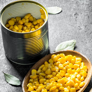 Open a can of corn, drain the water