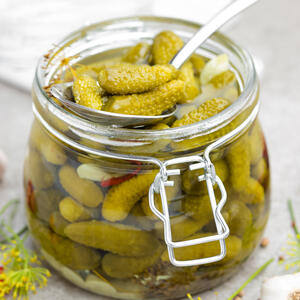 Next, cut the pickled cucumbers into cubes