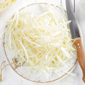 Cut cabbage into thin strips.